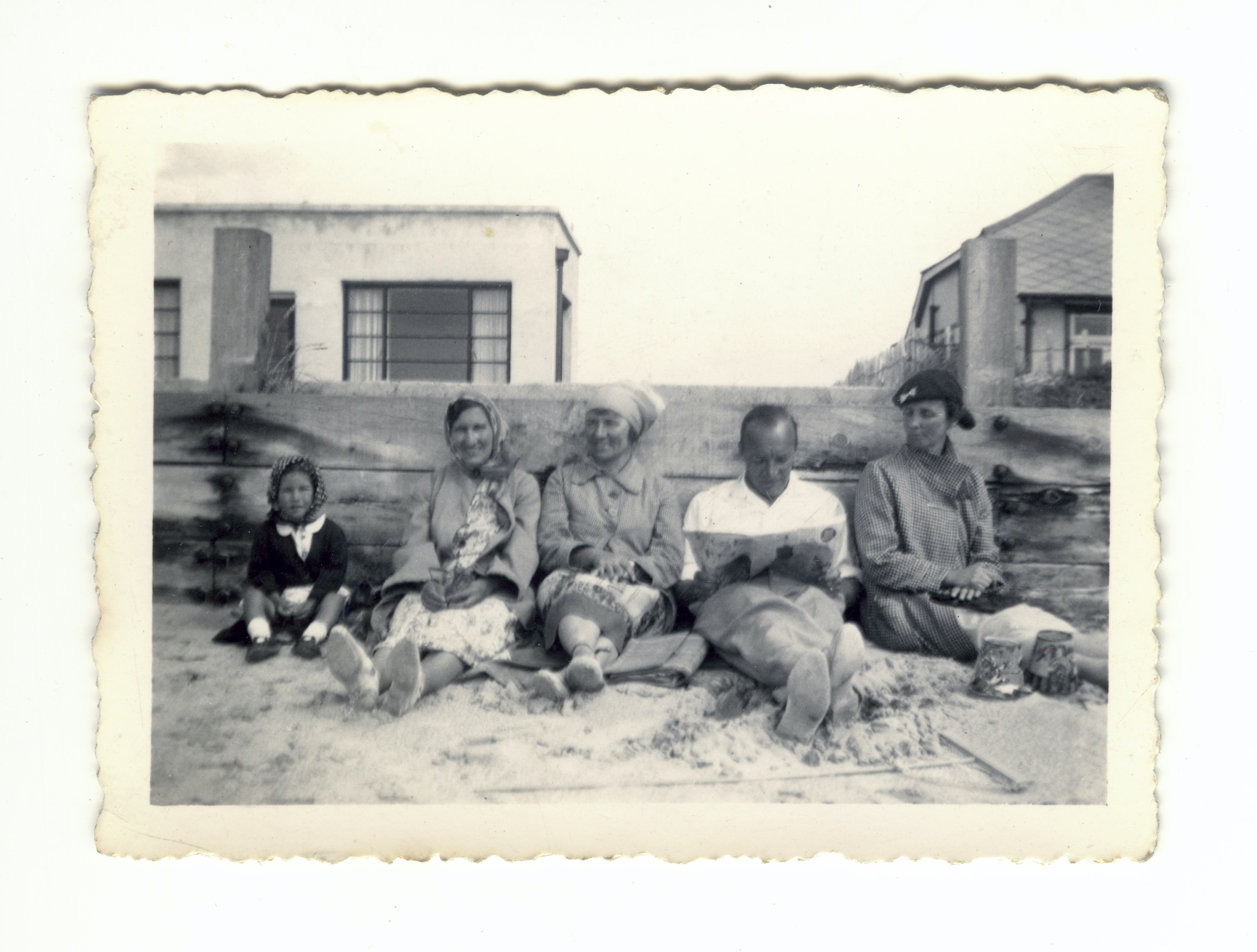Vintage photo of a family sitting outside